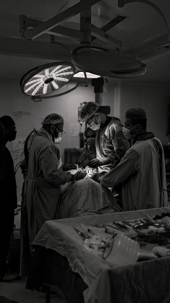 Mastering the First Impression: Your intriguing post title goes here Team of surgeons in an operating room conducting surgery in black and white.